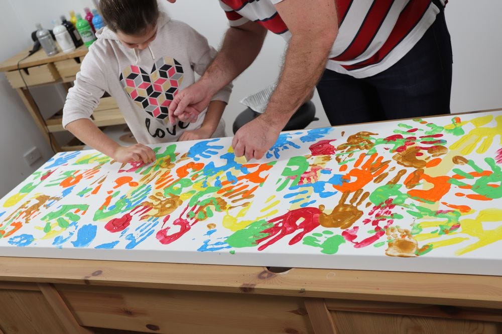 Create a family hand print painting